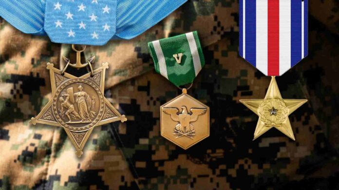 Three military medals displayed against a camouflage background