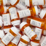 Massive $90M Fraud HITS Medicaid—Who’s Involved? A pile of prescription medication bottles with labels