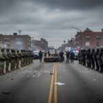 Flamethrower FRENZY Ignites Norfolk CHAOS Military and police forces facing off in a street during a tense situation