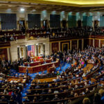 Congress HANDCUFFS Trump — Iran Watches Crowded legislative chamber with people seated and standing.