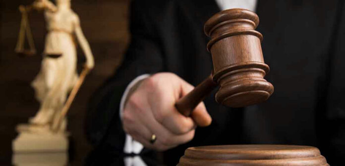 Gavel being struck on a sound block.