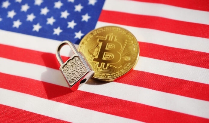 2086042837 Bitcoin and padlock on American flag.