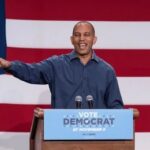 Scorching Attack Reframes GOP As ‘Extremist’ donald trump speaking at rally with Trump Vance sign