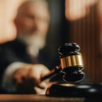 Judge's gavel striking a sound block in a courtroom
