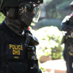 Police DHS officers in tactical gear on duty.