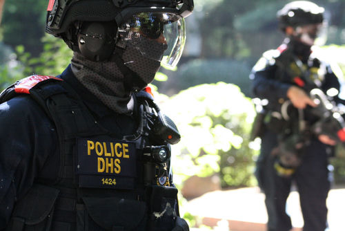 shutterstock_1801251979-2- Police DHS officers in tactical gear on duty.