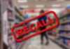 Botulism Fears Hit TARGET SHOPPERS A blurred grocery store aisle with a prominent RECALL sign in red