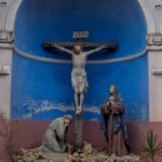 Sculptural depiction of the crucifixion with figures of Mary and John