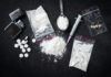 Undetectable Killer Sweeps U.S. Drug paraphernalia including syringes, pills, and powder.