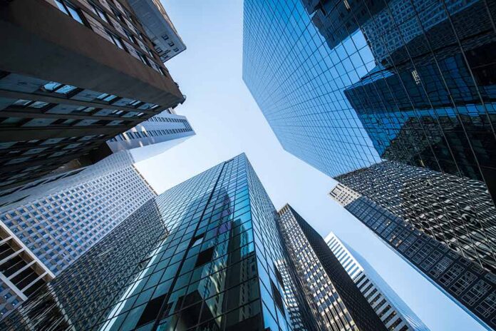 shutterstock_1499939441 Skyscrapers converging upward toward a clear sky