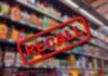 Recall notice over blurred store shelves.