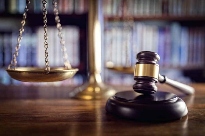 Scales of justice and gavel in courtroom.