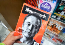 Person holding Newsweek magazine with Elon Musk cover.