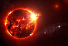 Fiery Sun emitting solar flares in outer space.