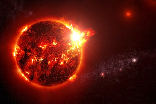 Fiery Sun emitting solar flares in outer space.