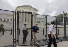 Security officials at the Supreme Court gates.